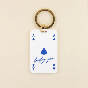 Lucky You Keychain in white acrylic with blue details and solid brass hardware | Shop Freshwater