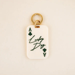 Limited Edition Lucky Dog Pet Tag in white acrylic with green details and solid brass hardware | Shop Freshwater